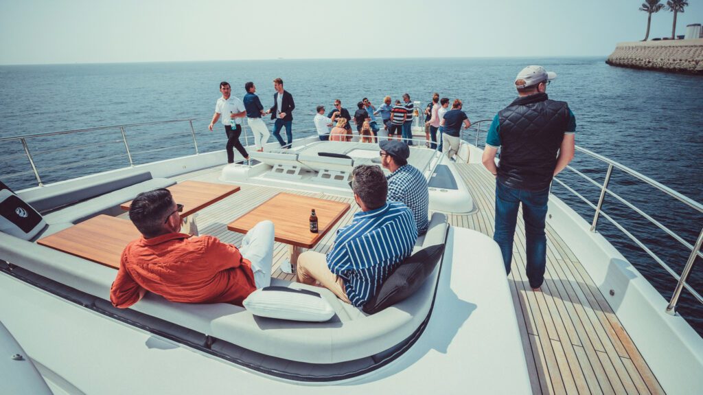 Employees enjoying a corporate event on luxury yachts