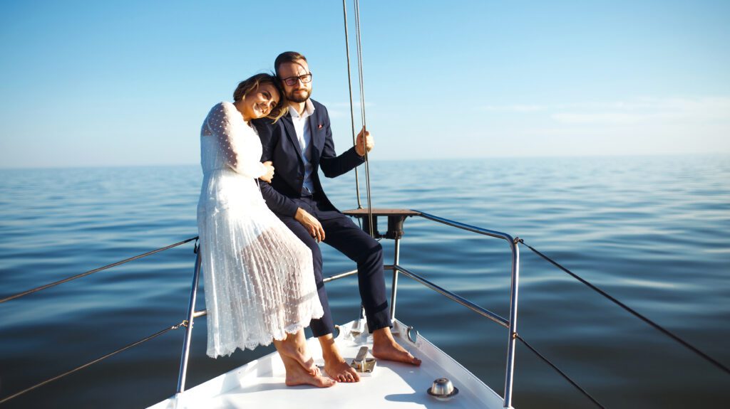 Couples enjoying their wedding party on a luxury yacht